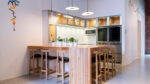 Warm kitchen colours and the exposed brick walls